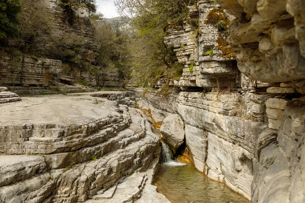 Papingo rock pools in Northern Greece with green waters near the village of Papingo in Zagori region