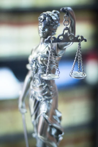 Legal justice statue in law firm office