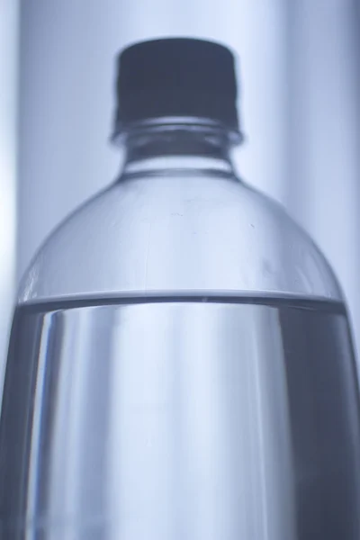 Soda lemonade soft drink bottle plain blue studio background — Stock Photo, Image