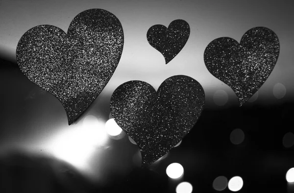 Vier liefde harten in silhouet nacht bokeh DOF — Stockfoto