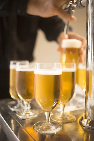 Lager draft beer glasses pump in restaurant bar — Stock Photo, Image