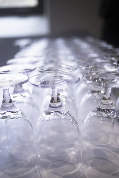 Upturned wine glasses in restaurant bar close-up — Stock Photo, Image