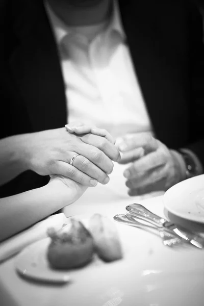 Bride and bridegroom in wedding marriage reception holding hands — Stock Photo, Image
