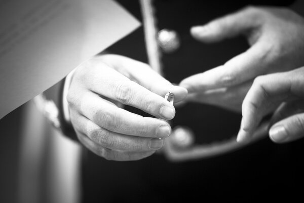 Bride and bridegroom in wedding marriage ceremony holding hands