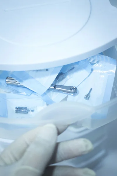 Dentist hand in glove preparing dental operation drawer — Stock Photo, Image