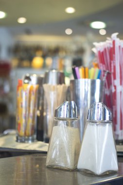 Salt and pepper shakers in restaurant cafe bar