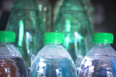 Plastic water bottles in window light