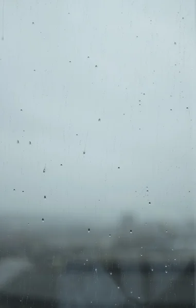 Raindrops on window gray rainy day — Stock Photo, Image