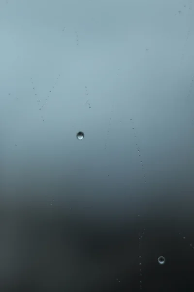 Raindrops on window gray rainy day — Stock Photo, Image