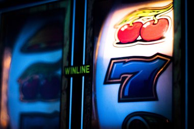 One arm bandit slot machine in casino clipart