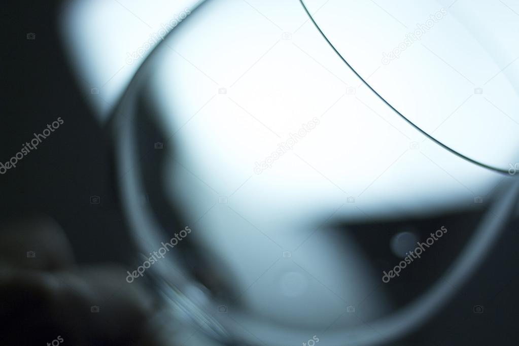 Wine glass at night in light