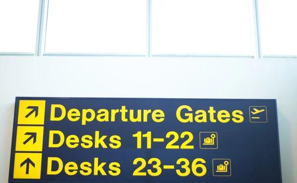 Airport departures and desks sign — Stock Photo, Image