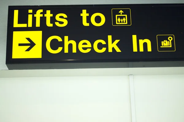 Informações do aeroporto luz sinal checkin — Fotografia de Stock