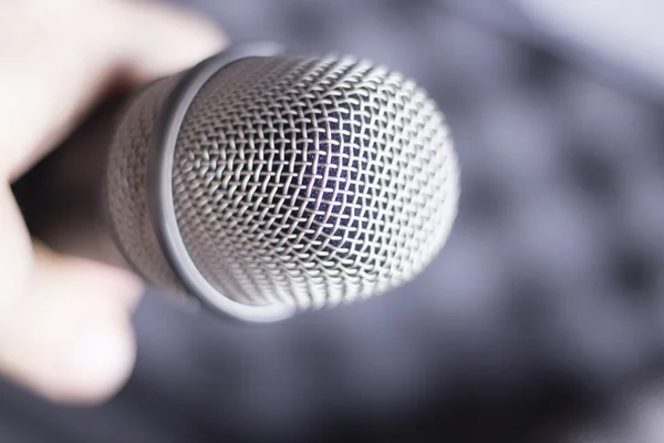 Professional microphone held in hand — Stock Photo, Image