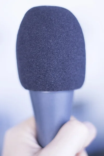 Professional microphone held in hand — Stock Photo, Image