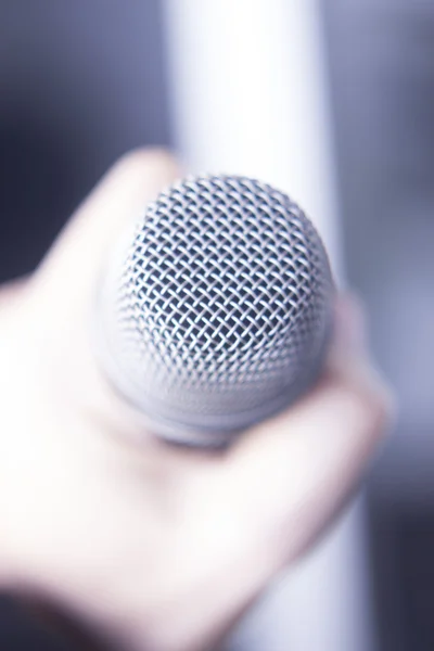 Professional microphone held in hand — Stock Photo, Image