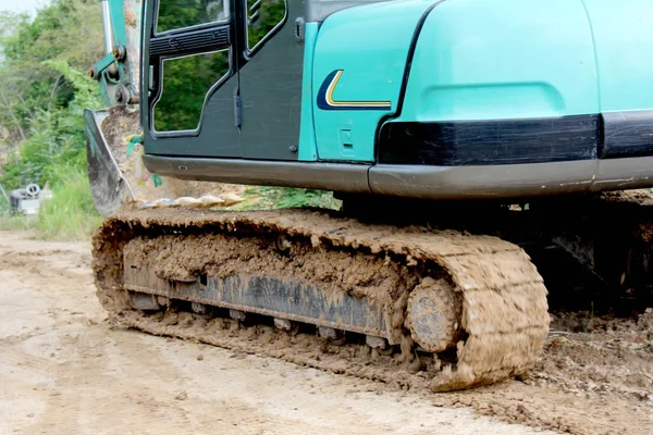 Backhoe the excavator in action in the forest. — Stock Photo, Image