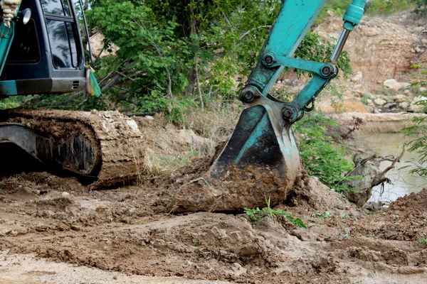 Backhoe the excavator in action in the forest. — Stock Photo, Image