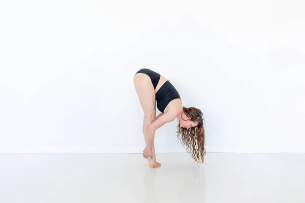 Young Red Haired Woman Practices Yoga Pose Head Black Tracksuit — Stock Photo, Image