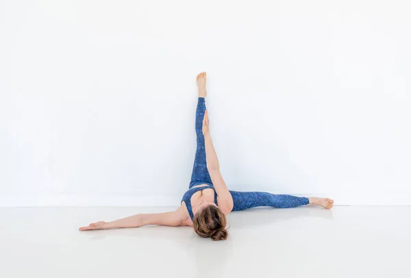 Young Diverse Woman Practices Yoga Pose Standing Floor White Studio — Stock Photo, Image