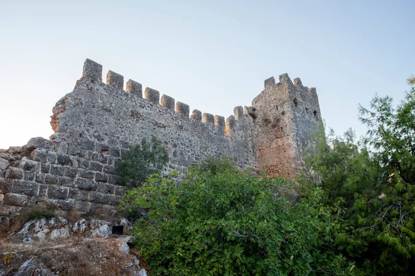 Elements of an ancient fortress. ancient city. Fortress on the rocks. Ruined walls of a medieval castle on the mountain.