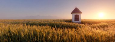 Slovakia countryside with chapel clipart