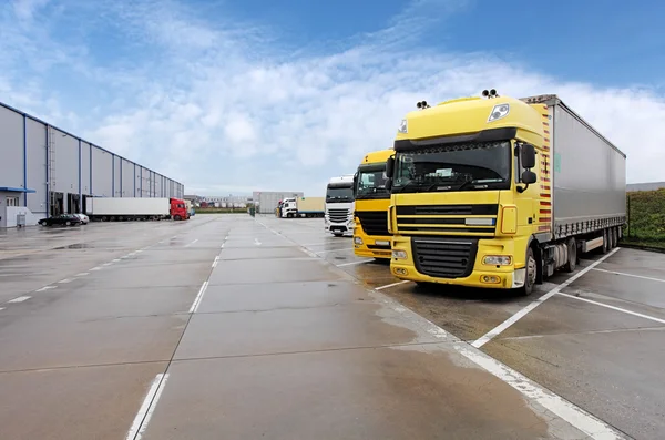 Yellow truck in warehouse — Stock Photo, Image