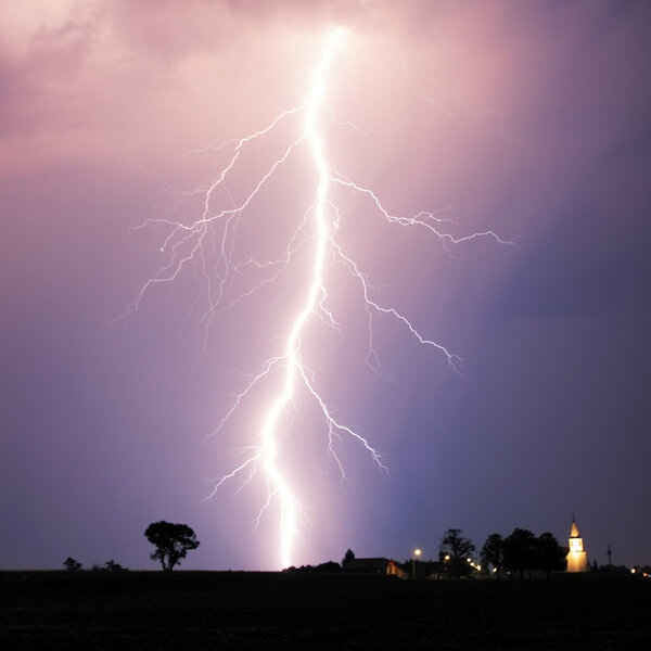 Lightning bolt at strom over village