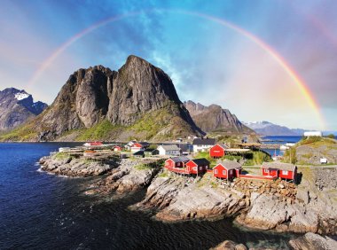 Norwegian fishing village huts with rainbow, Reine, Lofoten Isla clipart