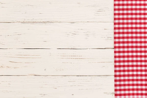 White table background with rustic red tablecloth