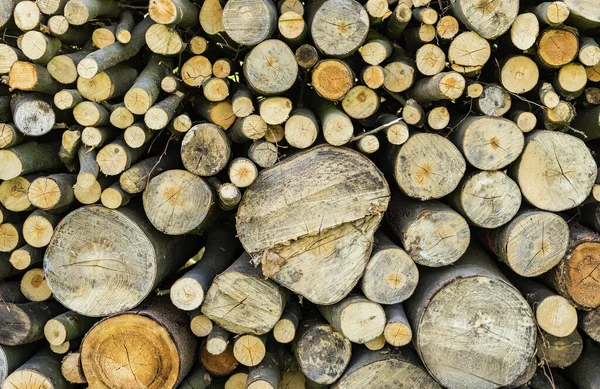 Pile of chopped wood for fireplace, background texture