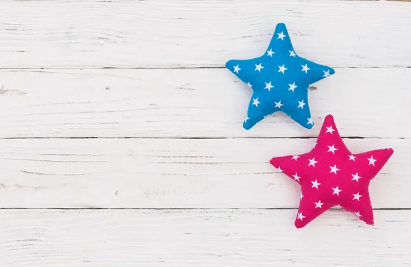 Fabric stars on white background with copy space