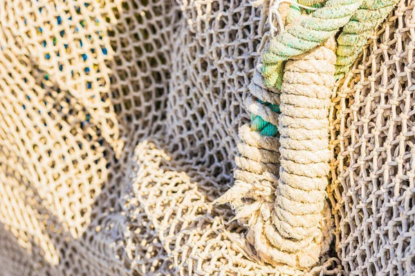 Close-up of commercial fishing net at harbor