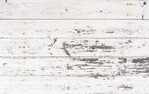 Old weathered white wooden planks for background texture