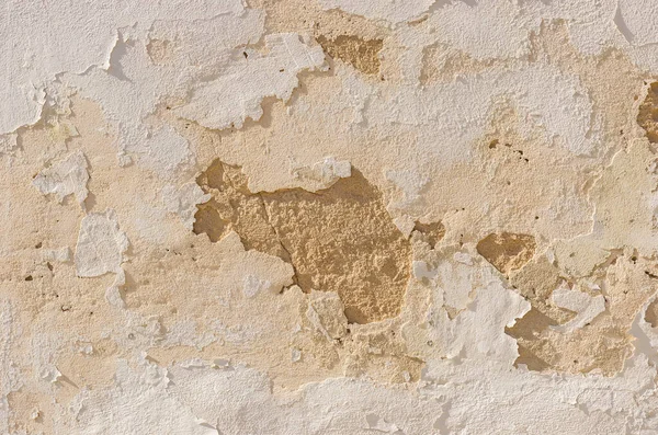 Close-up of old damaged wall plaster background texture