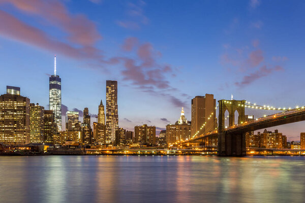 Brooklyn bridge and downtown New York City at night.