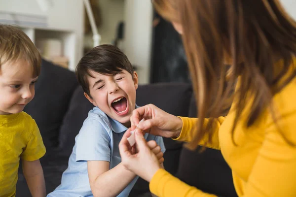 Mother Puts Bandage Son Finger — Stock Photo, Image