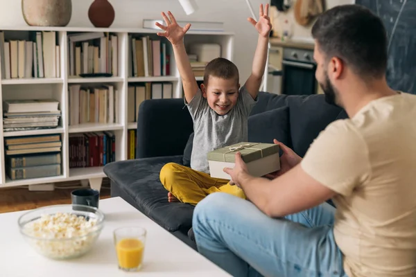 Father Son Sharing Gifts Home — Stock Photo, Image