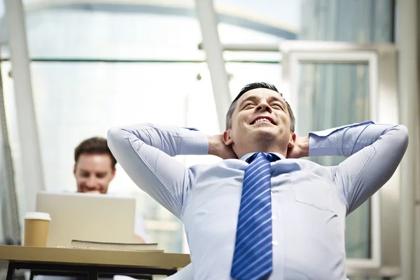 Businessman thinking in office — Stock Photo, Image