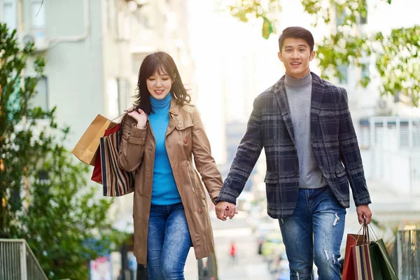 Happy Young Asian Couple Walking Street City Shopping Bags Hands — Stock Photo, Image