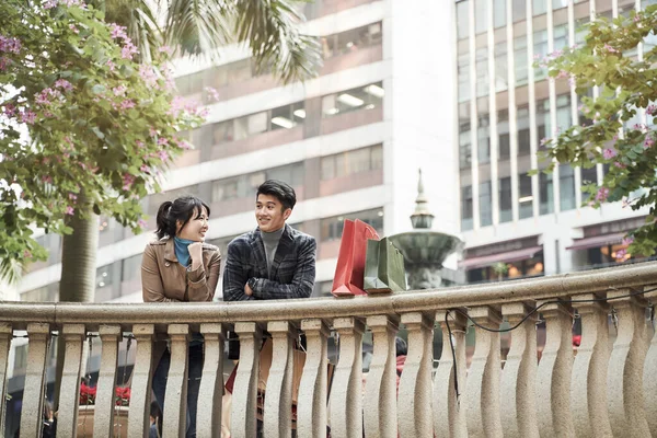 Happy Young Asian Couple Taking Break Chatting Talking While Shopping — Stock Photo, Image