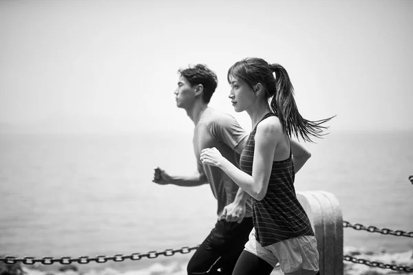Young Asian Man Woman Running Jogging Outdoors Sea Side View — Stock Photo, Image