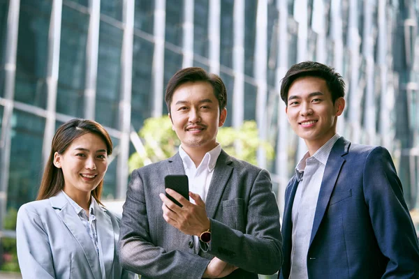 Outdoor Portrait Team Three Asian Businesspeople Looking Camera Smiling — Stok fotoğraf