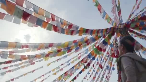 Asian Female Tourist Walking Strings Tibetan Prayer Flags — Stock Video