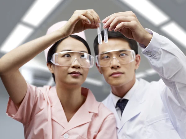 Asian medical professionals at work — Stock Photo, Image