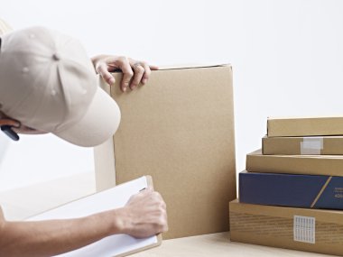Receiving clerk checking packages received clipart