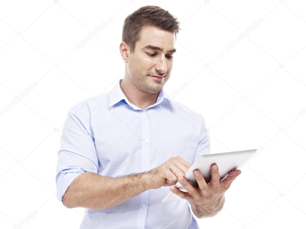 caucasian businessman using tablet computer