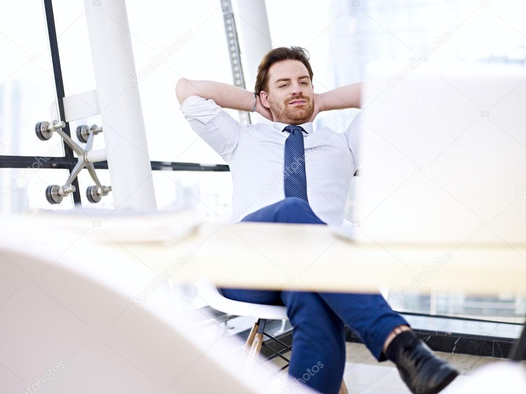 business person daydreaming in office