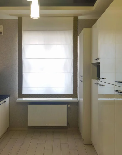 Roman blind in the interior of the kitchen