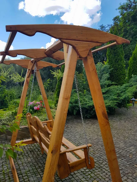 wooden swing in the garden